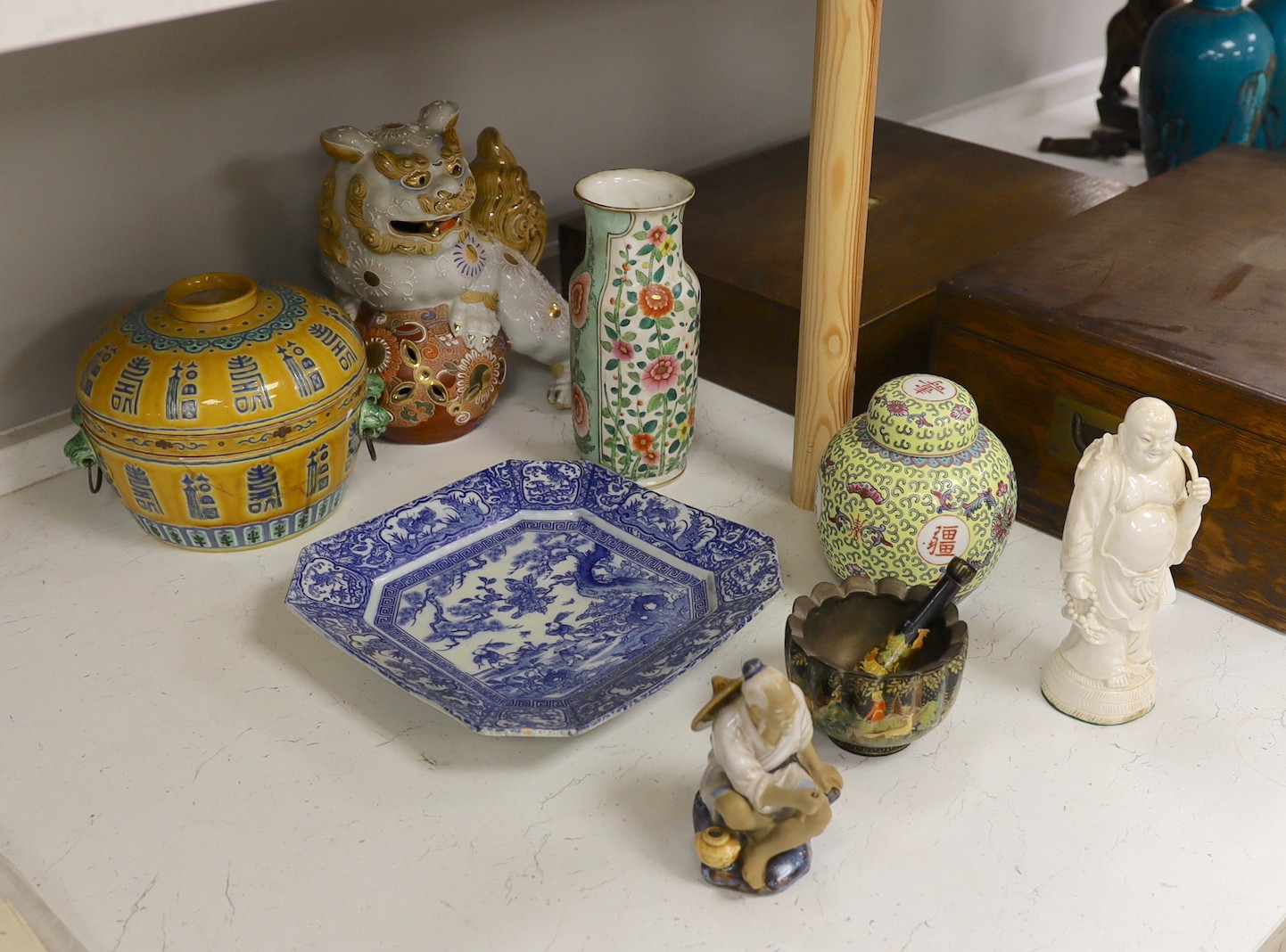 A collection of mostly Chinese ceramics, to include a vase, a lion dog, pestle and mortar etc.